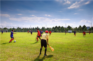 Boys Soccer Game On A Sunny Day